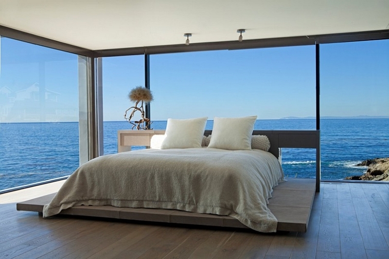 Bedroom with ocean views and glass walls