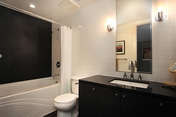 Black and white bathroom with large mirror
