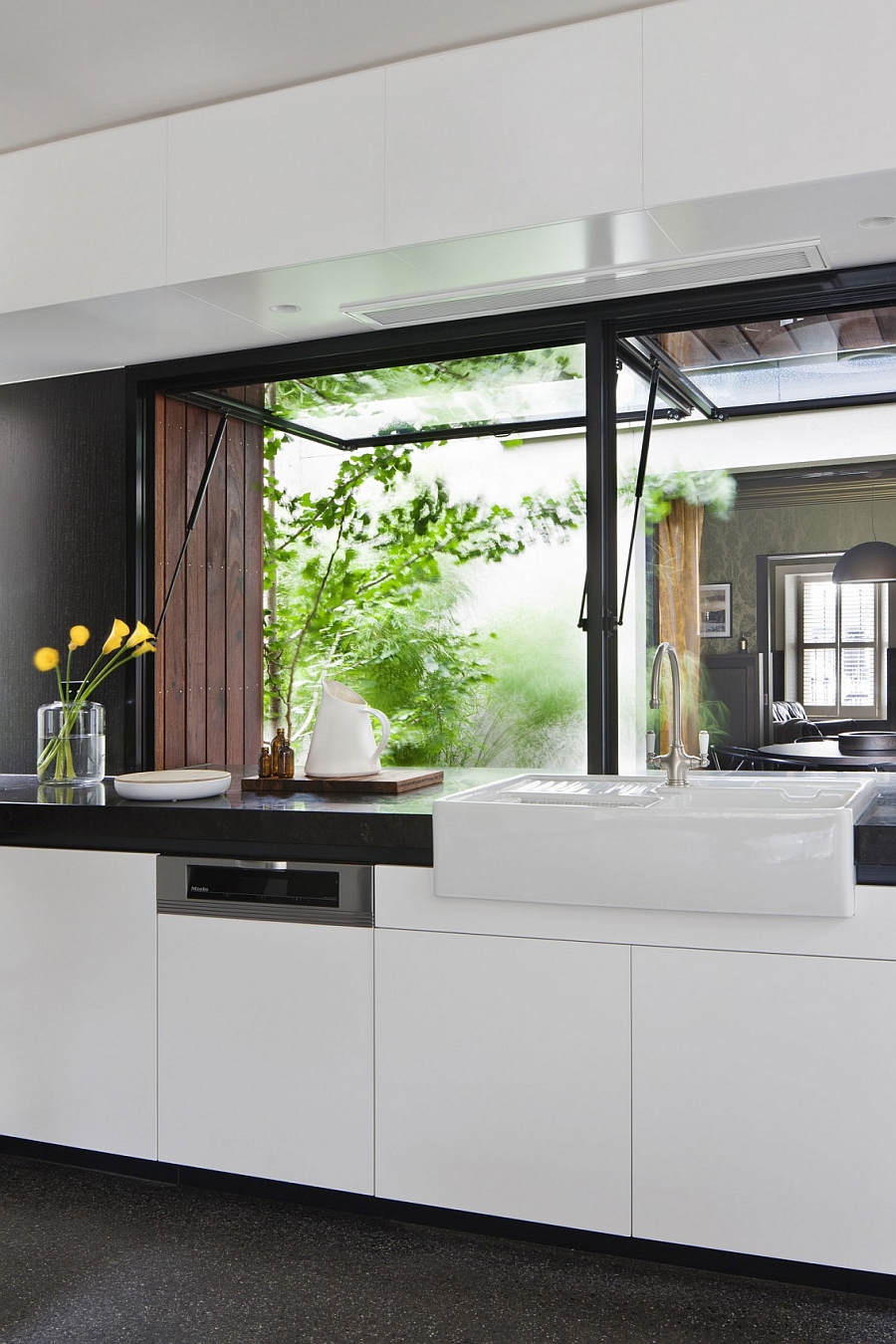 Black kitchen countertop with a white sink