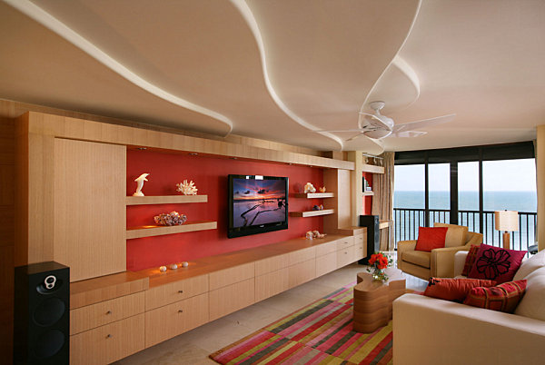 Bright red accent wall in a warm-toned living room