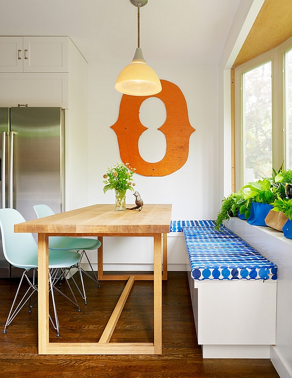 Combine the corner bench with a couple of Eames Molded Plastic Chairs