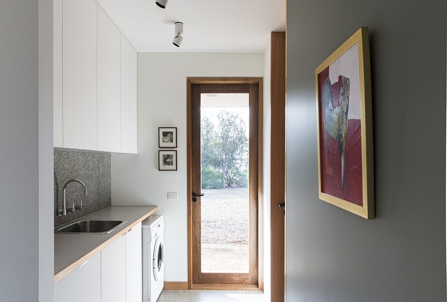 Compact laundry space next to the kitchen