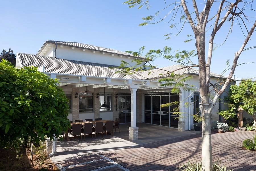 Contemporary villa facade in Israel with traditional tiled roof