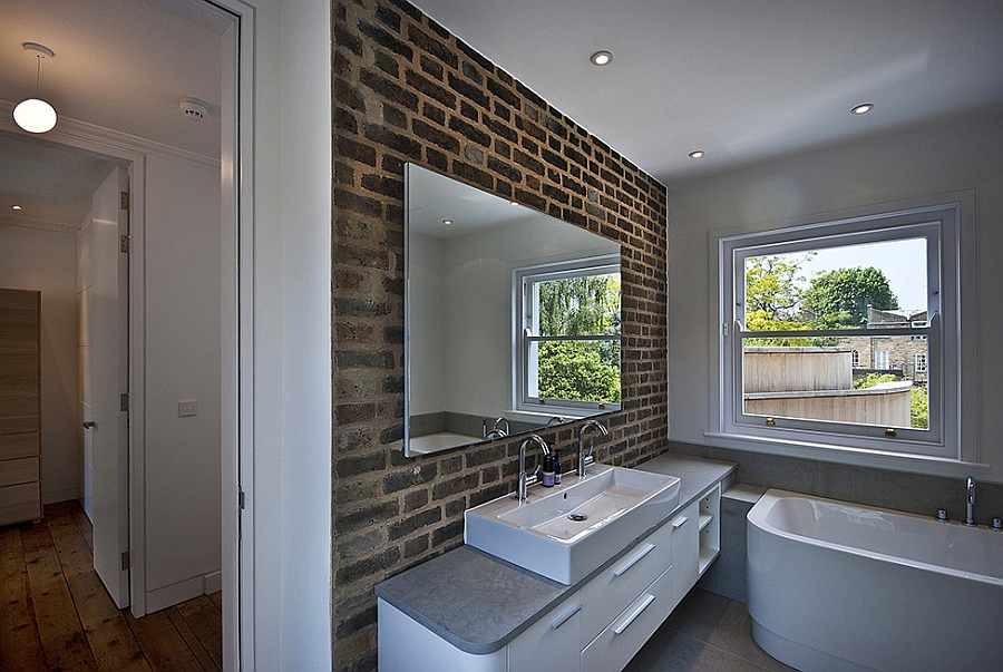 Cool exposed brik wall in the modern bathroom