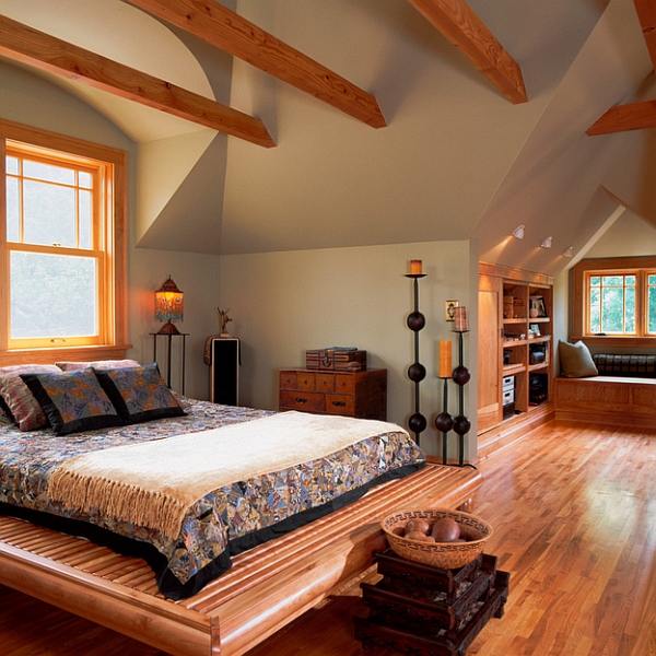 Cozy attic bedroom idea with a window seat