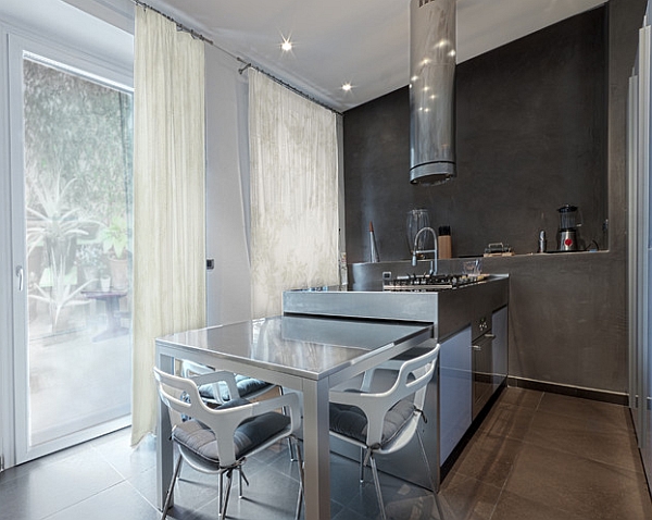 Dining table that slides into the kitchen island when not in use!