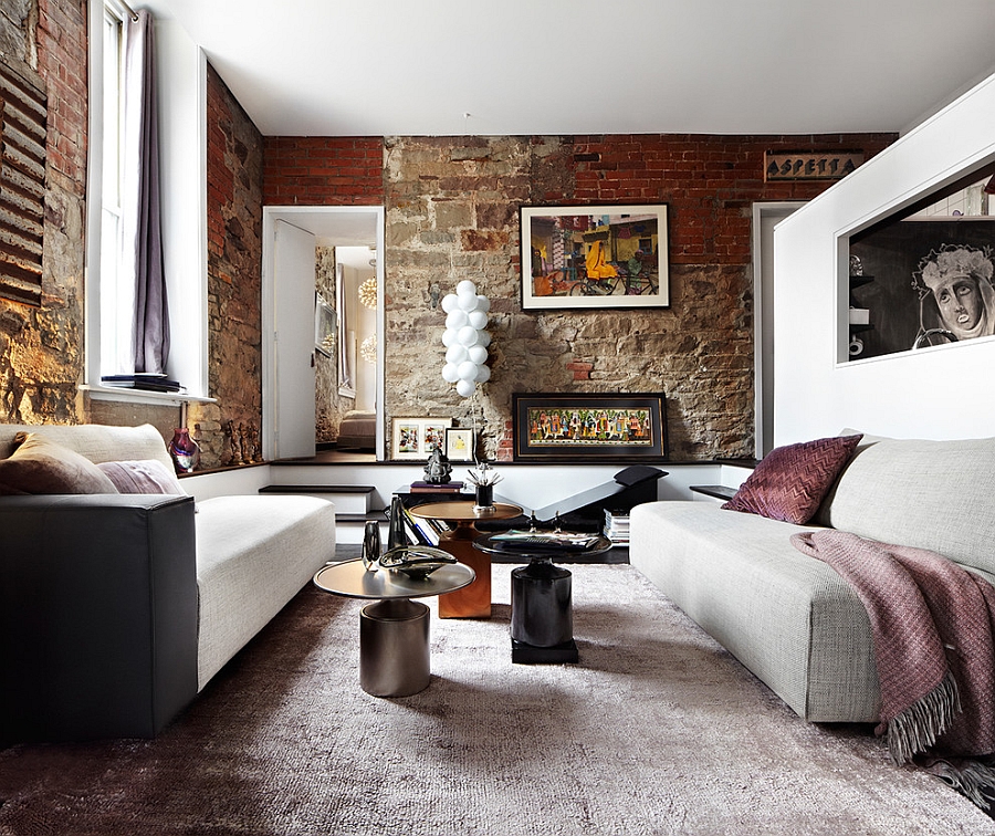 Exposed brick wall in the living room gives an eclectic look