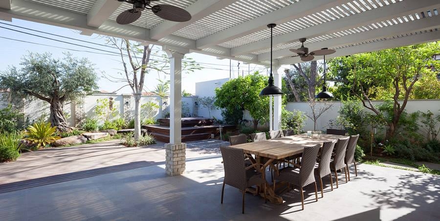 Extended pergola offers shade to the patio