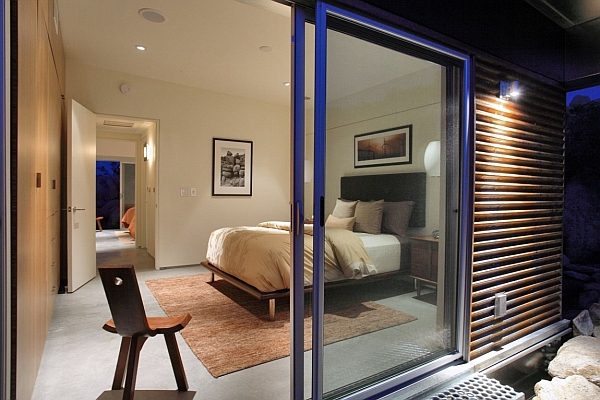 Glass doors give the small bedroom a spacious look