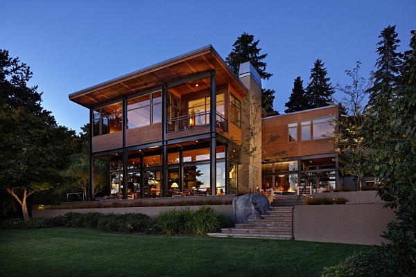 Glass lake house with bold steel frame