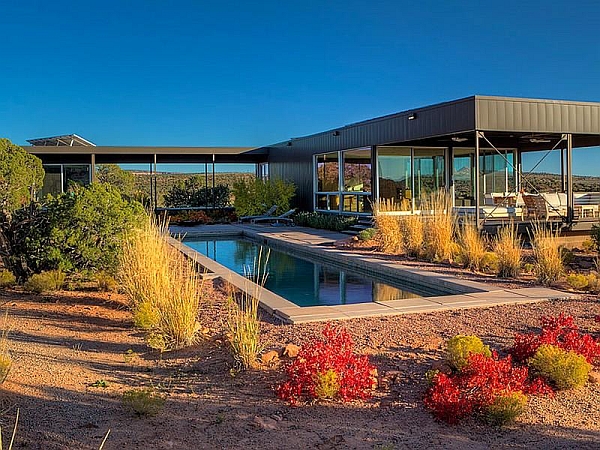 Goregous landscape surrounds the steel-framed prefab house