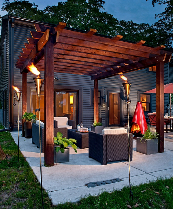 Gorgeous torches create a truly spellbinding pergola setting