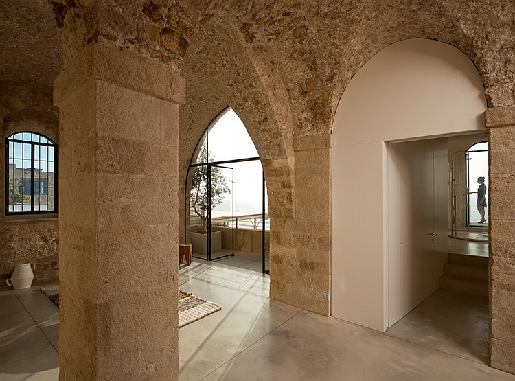 High ceiling and arched doorways in stone of modern house