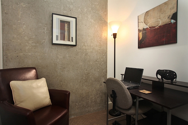 Home work area with exposed concrete wall