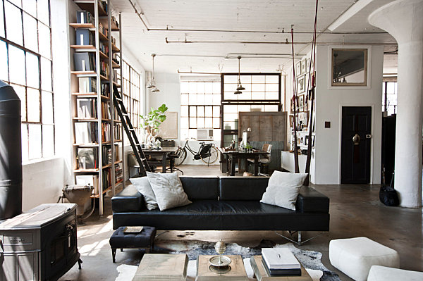 Industrial New York living room with exposed pipes