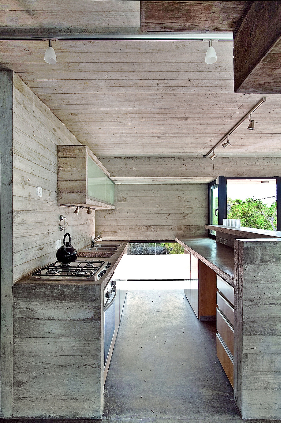 Kitchen with exposed concrete and wood