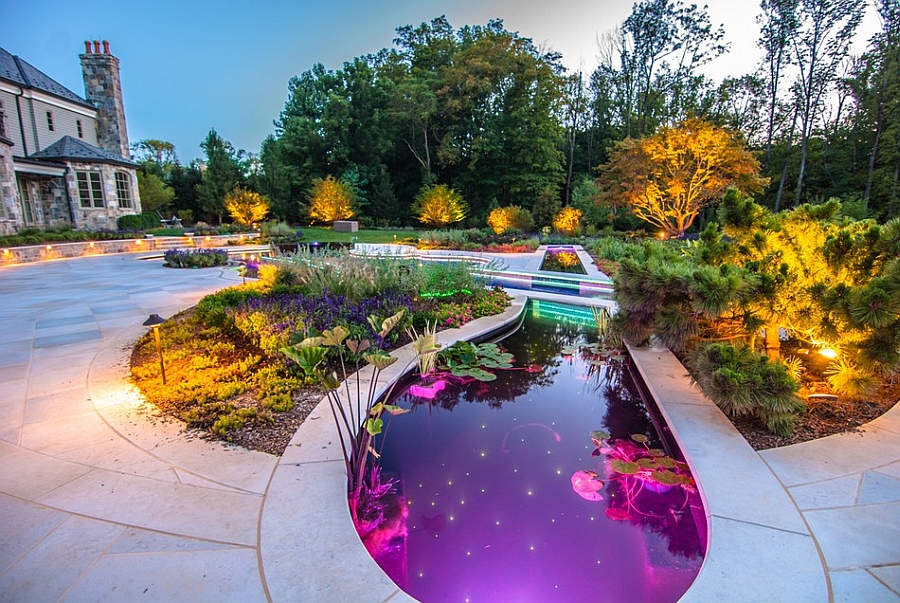 Koi pond next to the pool with LED lighting