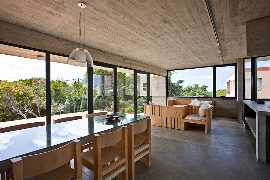 Living area surrounded by glass windows