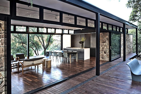 Lovely steel frame and glass pavillion creates an airy setting