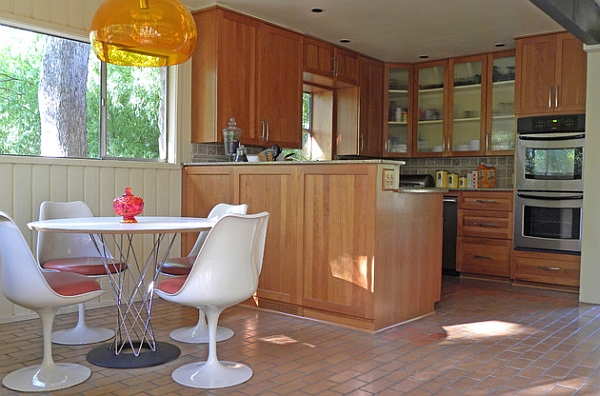 Sleek base of the Tulip chairs and the Cyclone Table saves up on ample space