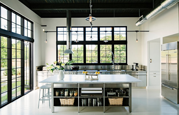 Stainless steel surfaces in an industrial interior design style kitchen