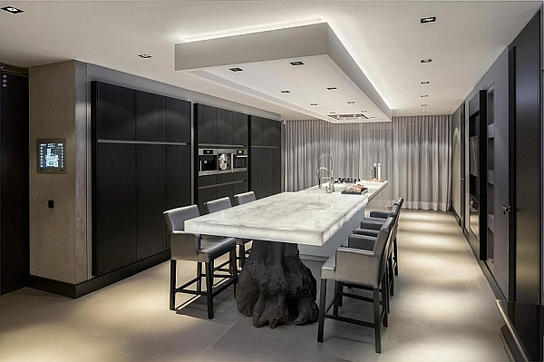 Stunning dining room and kitchen with illuminated white Onyx top