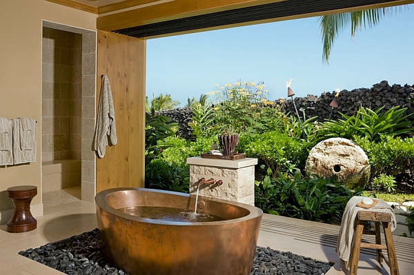 Stunning tropical ambiace combines beautifully with the copper tub on a bed of river stones