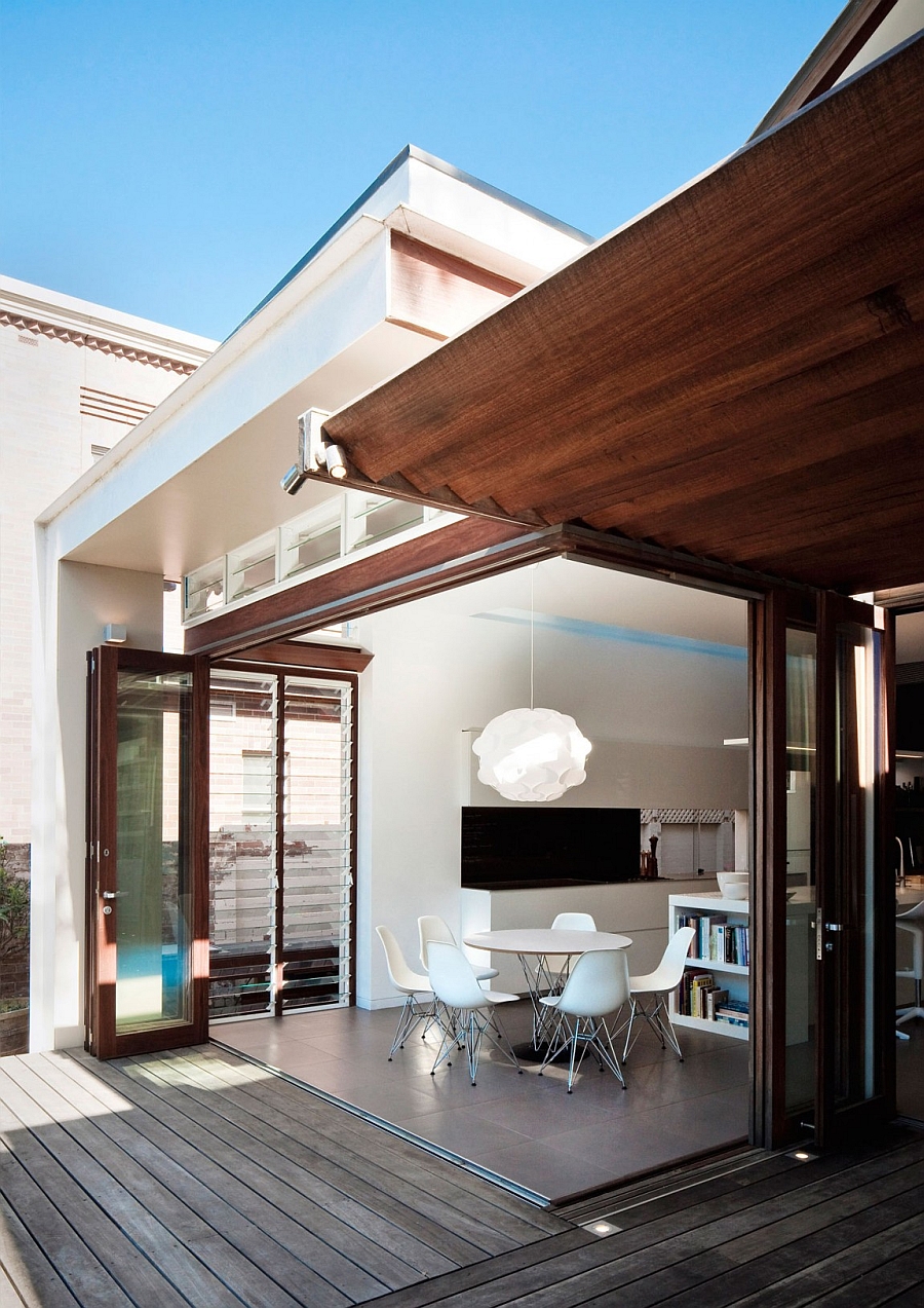 Stylish dining area extends into the backyard