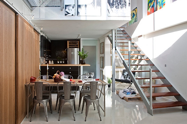 Table at the dining area seems like a natural extension of the wooden walls