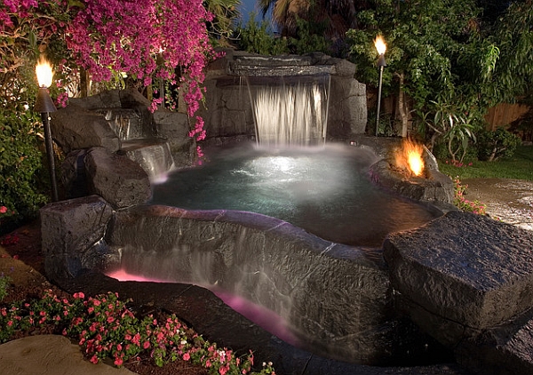 Tiki torches add to the natural ambiance of the waterfall pool