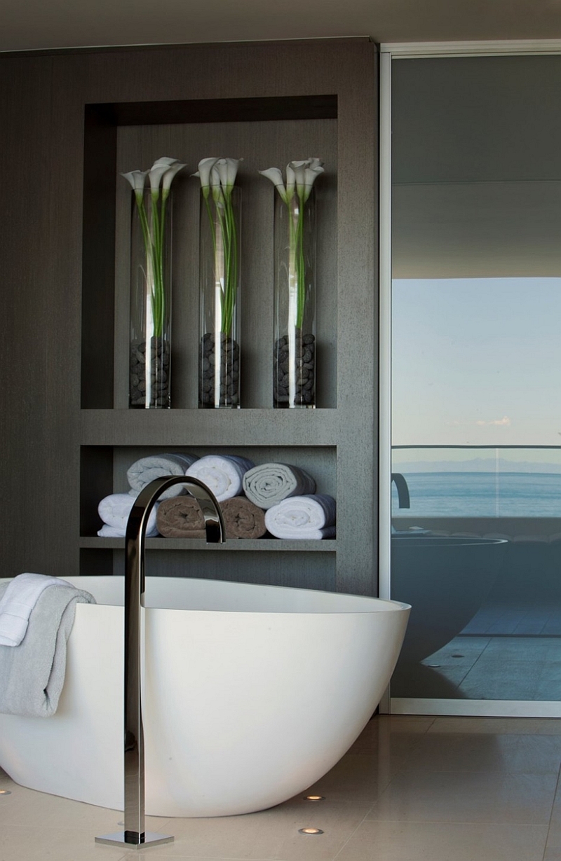 Towel and flower vase arrangement in the bathroom