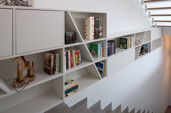 Wall-mounted bookcase next to the stairs