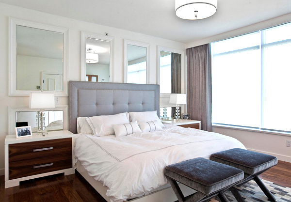 Wall of mirrors in a chic bedroom