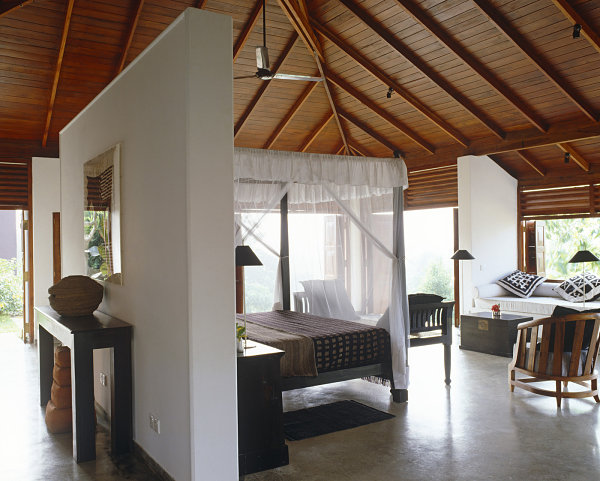 White and wooden tones in a tropical bedroom