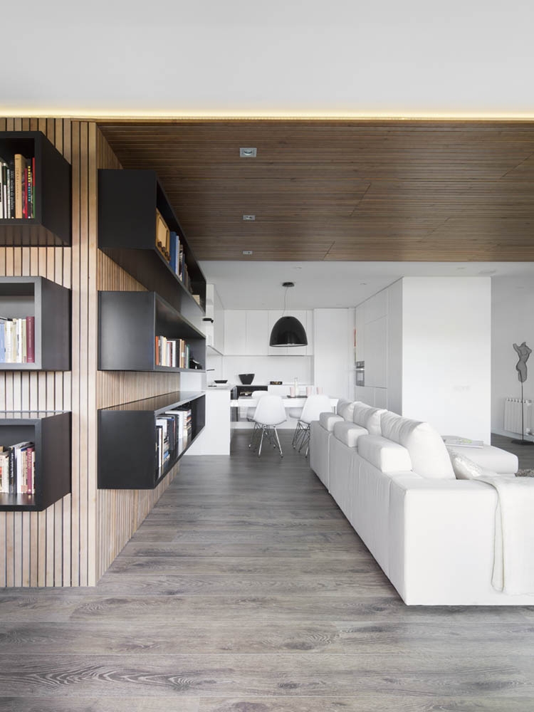 Wooden walls that house the stylish book shelves