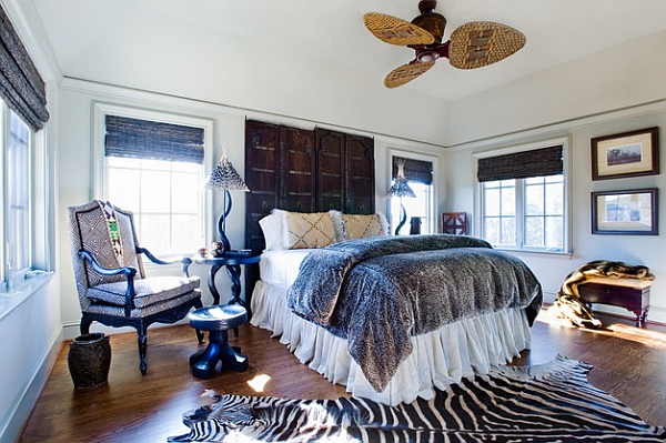 Zebra rug and African textiles used in the trendy bedroom