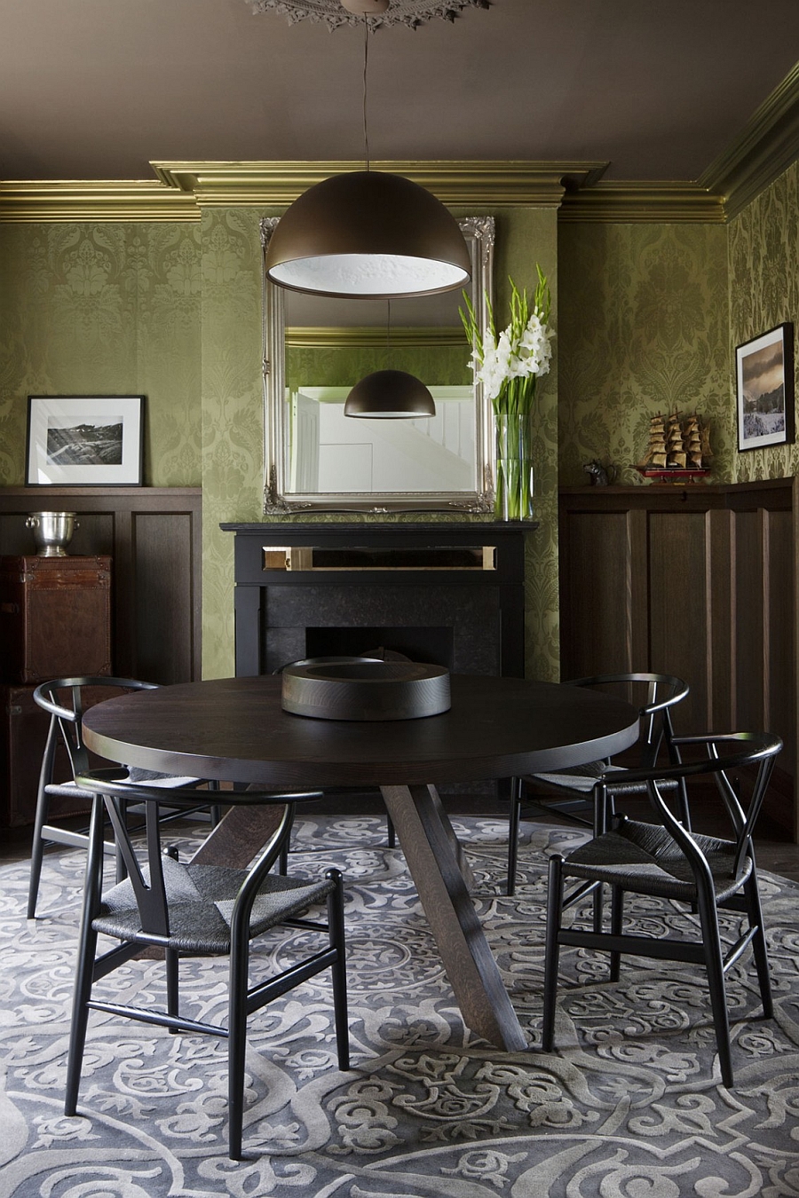 large pendant light above the small dining area