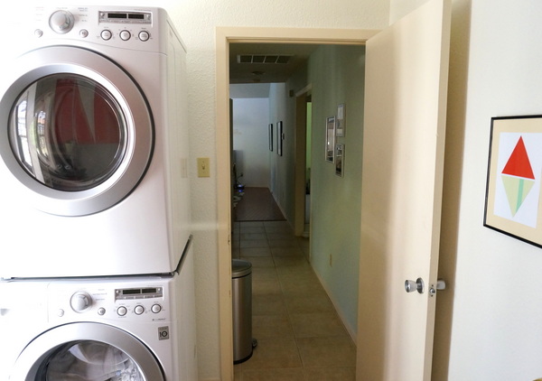 Appliances and art coexist in this laundry room