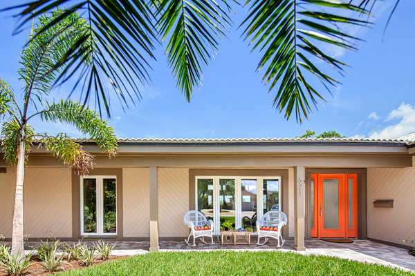 Bright orange door on a ranch house