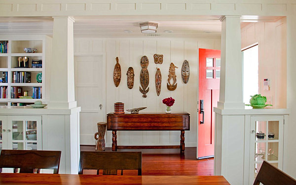 Cottage entryway with tribal masks