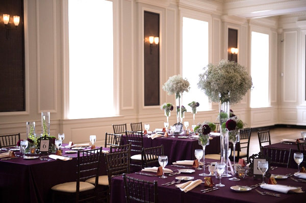 Deep purple tablecloths at a contemporary wedding