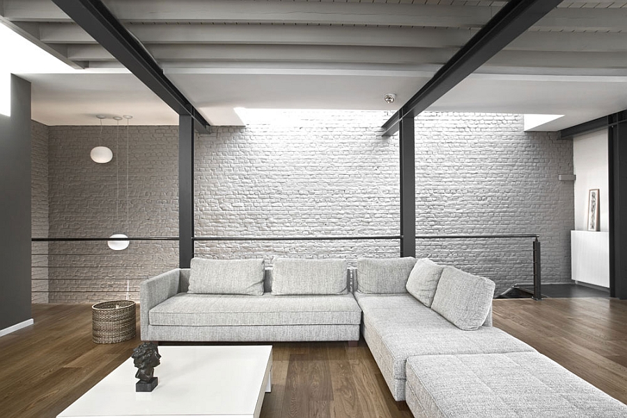 Exposed brick walls and steel frame in the living room