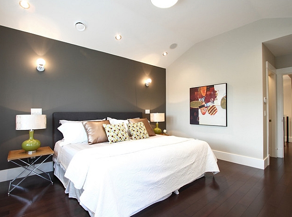 Grey accent wall in a white bedroom