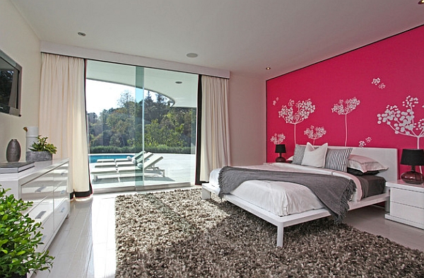 Hot pink and lovely decal work give the bedroom a cool personality