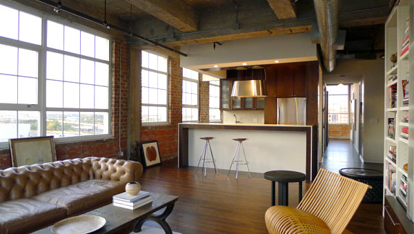 Industrial loft living room with a tufted sofa