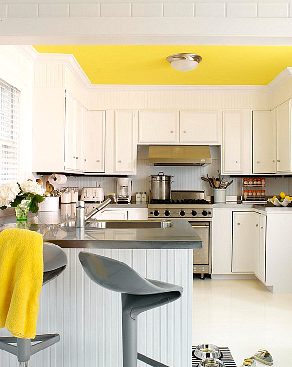 Lemon yellow ceiling in a crisp kitchen