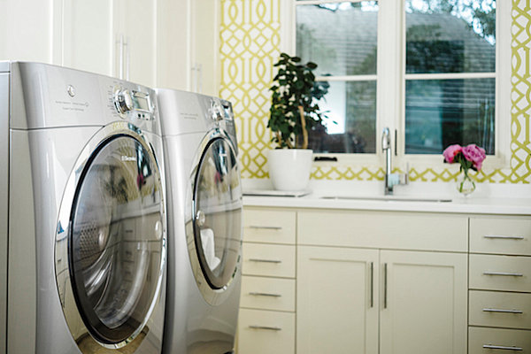 Plant and floral touches in an organized laundry room