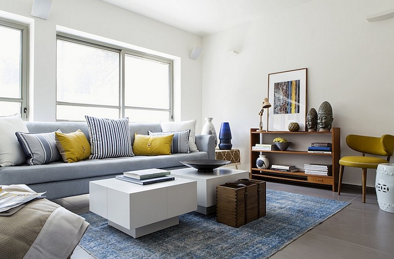 Plush couch in cool blue with yellow accent pillows