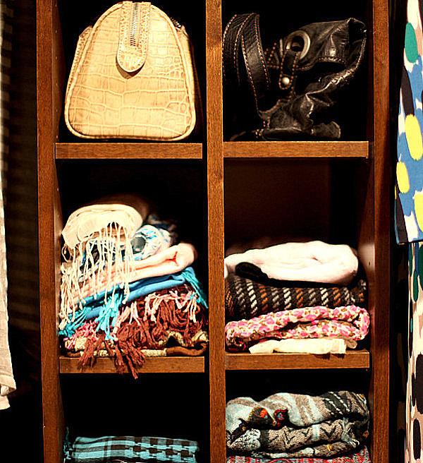 Shelves hold folded scarves