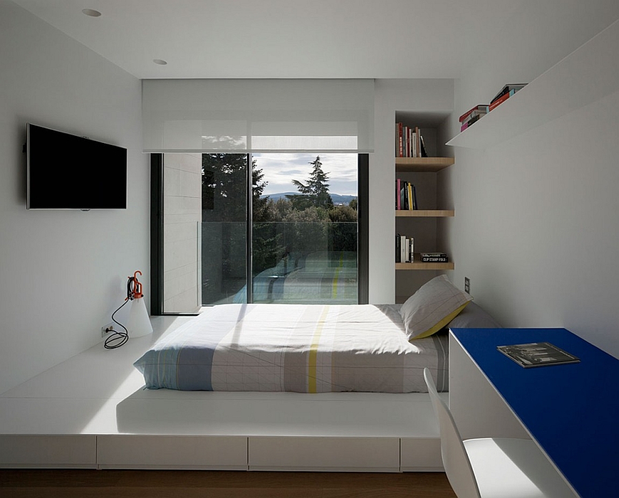 Sleek minimalist bedroom in white